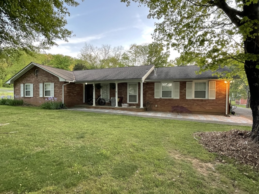 Katie Beeler's 1960s pink-brick ranch before its exterior was painted